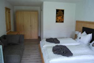 Postel nebo postele na pokoji v ubytování PAGA Hotel