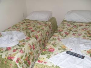Cama ou camas em um quarto em Hotel Estação da Fé