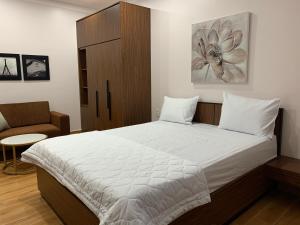 Postel nebo postele na pokoji v ubytování MK Studio - Liên Phuong - District 9