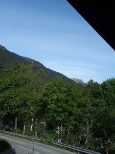 a view of a road with mountains in the background at Haus Gabriele in Gaschurn +7 photos