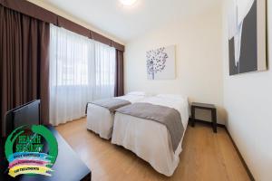 Łóżko lub łóżka w pokoju w obiekcie Hotel Delfino Venezia Mestre
