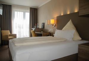 Postel nebo postele na pokoji v ubytování Hotel Morjan