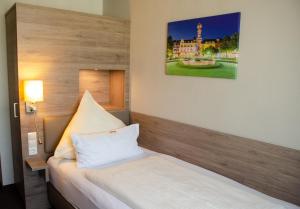 Postel nebo postele na pokoji v ubytování Hotel Morjan