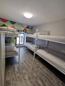 Voodi või voodid majutusasutuse Fiesta Siesta Social Hostel toas