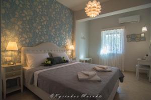 Ένα ή περισσότερα κρεβάτια σε δωμάτιο στο La Casa Del Vitsi