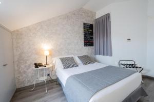 Posteľ alebo postele v izbe v ubytovaní Aparthotel Atenea Calabria