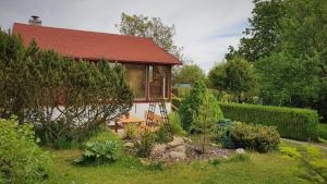 a house with a red roof and a garden at Chata Suchdol in Suchdol nad Lužnicí