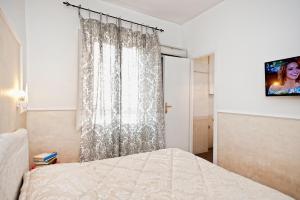 A bed or beds in a room at Romacentrarte