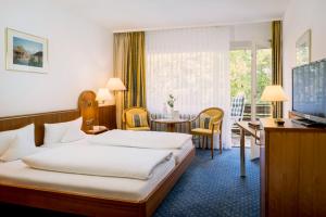 Postel nebo postele na pokoji v ubytování Kurhotel Markushof
