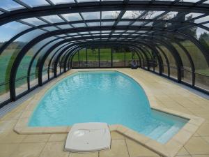 an overhead view of a swimming pool in a building at La Lauriére in Treize-Vents