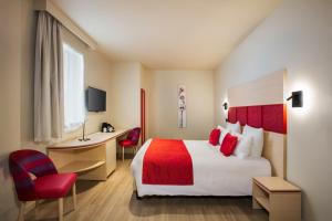 Un ou plusieurs lits dans un hébergement de l'établissement Best Western Plus Hôtel Escapade Senlis