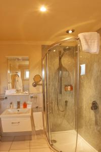 a bathroom with a shower and a sink at Cringletie House in Peebles
