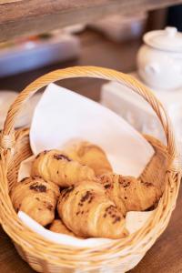 a basket filled with pastries on top of a table at Landgasthof Karner in Frasdorf