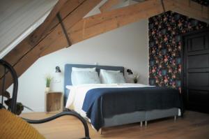 Postel nebo postele na pokoji v ubytování Bed & Brood De Vogelpoel + 7 fotografií