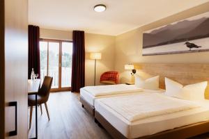 Postel nebo postele na pokoji v ubytování Hotel Ahornhof