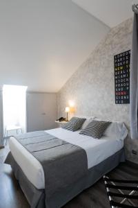 Posteľ alebo postele v izbe v ubytovaní Aparthotel Atenea Calabria