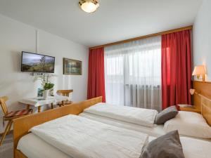Letto o letti in una camera di Hotel Baumgarten & Chalet Baumgarten