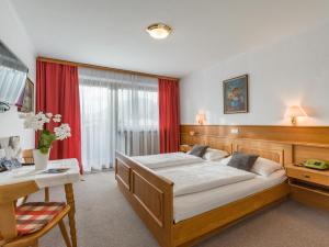 Letto o letti in una camera di Hotel Baumgarten & Chalet Baumgarten