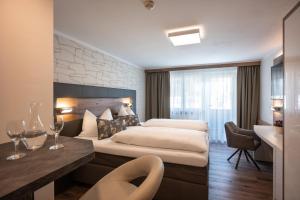 Letto o letti in una camera di Hotel Baumgarten & Chalet Baumgarten