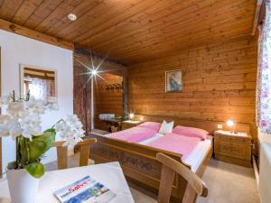 Letto o letti in una camera di Hotel Baumgarten & Chalet Baumgarten