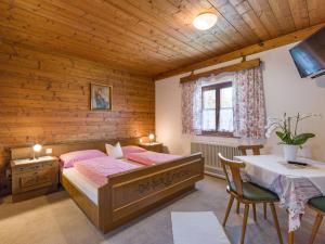 Letto o letti in una camera di Hotel Baumgarten & Chalet Baumgarten