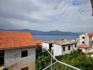 a view of the water from a city at Apartments Seagull in Postira