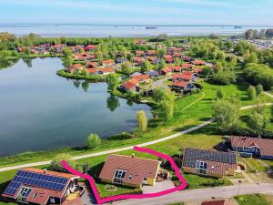 een luchtzicht op een dorp naast een meer bij 12 person holiday home in Otterndorf in Otterndorf