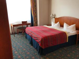 Ένα ή περισσότερα κρεβάτια σε δωμάτιο στο Hotel Johannishof