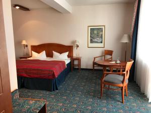 Postel nebo postele na pokoji v ubytování Hotel Johannishof