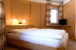 Postel nebo postele na pokoji v ubytování Sporthotel Spoegler