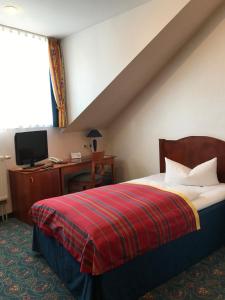 Ένα ή περισσότερα κρεβάτια σε δωμάτιο στο Hotel Johannishof