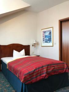 Ένα ή περισσότερα κρεβάτια σε δωμάτιο στο Hotel Johannishof