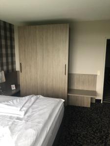 Postel nebo postele na pokoji v ubytování Hotel Albus