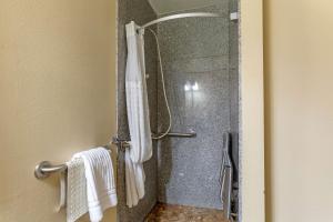 a shower in a bathroom with a glass door at Comfort Inn & Suites Page at Lake Powell in Page