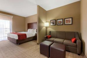 a hotel room with a bed and a couch at Comfort Inn & Suites Page at Lake Powell in Page