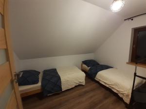 Un pat sau paturi într-o cameră la Brzozowy Zagajnik
