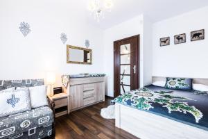 Ένα ή περισσότερα κρεβάτια σε δωμάτιο στο Apartament Tatry Jaszczurówka