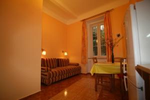 a living room with a couch and a table at Apartment No. 2 Tržiště 29 in Karlovy Vary