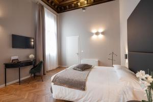 Posteľ alebo postele v izbe v ubytovaní Hotel Palazzo Martinelli Dolfin