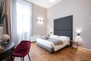 Posteľ alebo postele v izbe v ubytovaní Hotel Palazzo Martinelli Dolfin