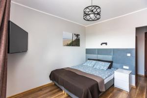 Postel nebo postele na pokoji v ubytování Dom Wczasowy Natalia
