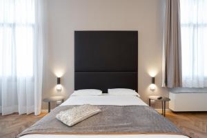 Posteľ alebo postele v izbe v ubytovaní Hotel Palazzo Martinelli Dolfin