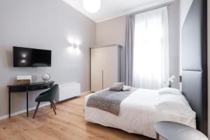 Posteľ alebo postele v izbe v ubytovaní Hotel Palazzo Martinelli Dolfin