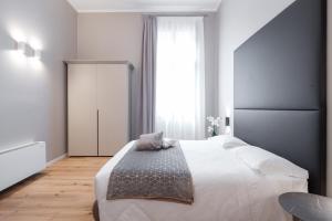 Posteľ alebo postele v izbe v ubytovaní Hotel Palazzo Martinelli Dolfin