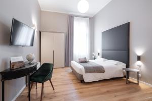 Posteľ alebo postele v izbe v ubytovaní Hotel Palazzo Martinelli Dolfin