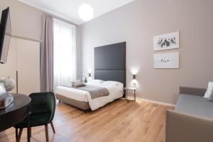 Posteľ alebo postele v izbe v ubytovaní Hotel Palazzo Martinelli Dolfin