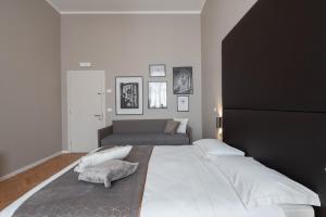 Posteľ alebo postele v izbe v ubytovaní Hotel Palazzo Martinelli Dolfin