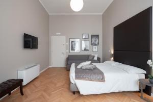 Posteľ alebo postele v izbe v ubytovaní Hotel Palazzo Martinelli Dolfin