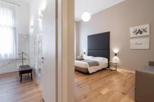 Posteľ alebo postele v izbe v ubytovaní Hotel Palazzo Martinelli Dolfin
