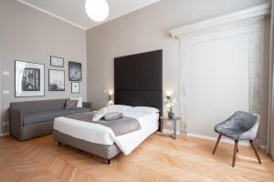 Posteľ alebo postele v izbe v ubytovaní Hotel Palazzo Martinelli Dolfin